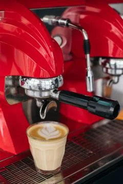 Brewing coffee on red retro machine Stock Photos