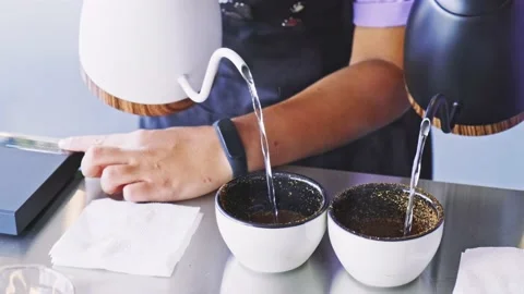 Brewing coffee for tasting from two teapots. Stock Footage 142303980