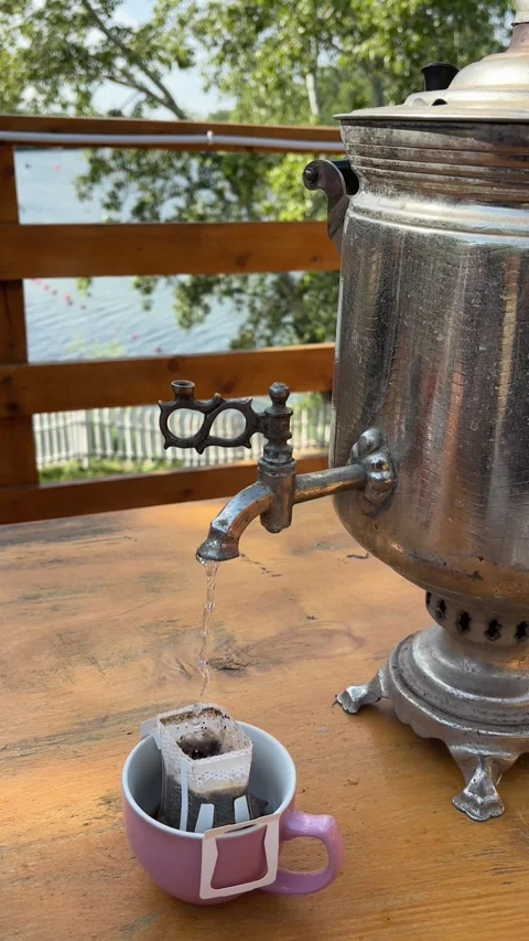 Brewing drip coffee in a bag using a samovar outdoor. Alternative method. Stock Footage 280376384