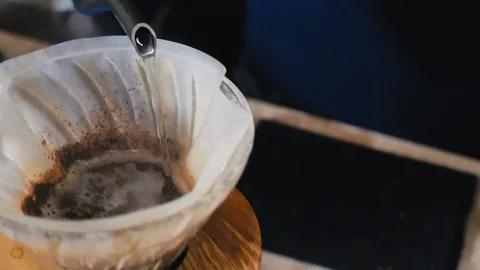 Brewing drip coffee through filter Stock Footage 129681590