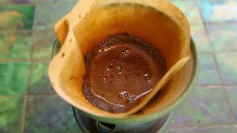 Brewing filter coffee on the table 스톡 동영상 100694245