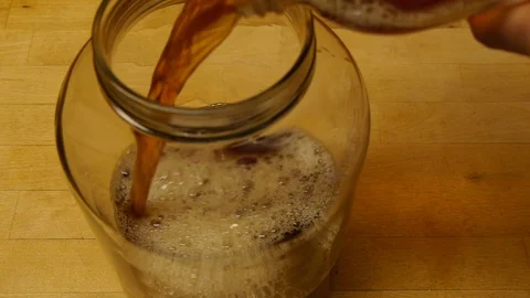 BREWING KOMBUCHA ADDING SCOBY Stock Footage 85872788