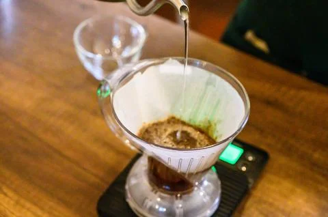 Brewing pour over coffee using a drip filter system Stock Photos