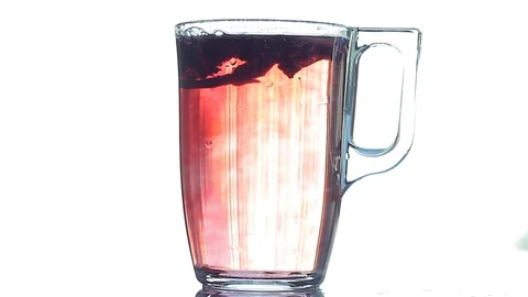Brewing Red Tea In Transparent Kettle Close-Up. Slow Motion. Stock Footage 128242198