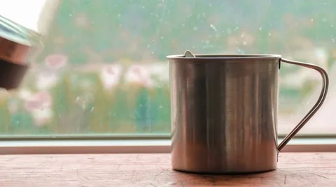 Brewing tea in metal mug Stock Footage 68618637