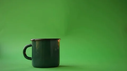 Brewing tea in natural packaging on a green background Stock Footage 129506402