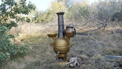 Brewing tea in samovar in nature_4K Stock Footage 126905509