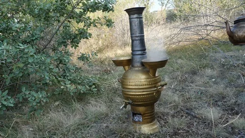 Brewing tea in samovar in nature_4K Stock Footage 126907171