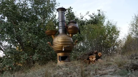 Brewing tea in samovar in nature_4K Stock Footage 126908829