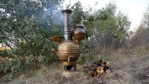 Brewing tea in samovar in nature_4K Stock Footage 126909396