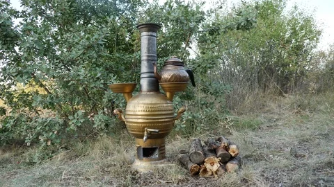 Brewing tea in samovar in nature_4K Stock Footage 126909462