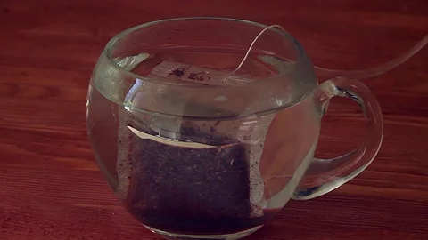 Brewing tea a transparent cup Stock Footage 74847326