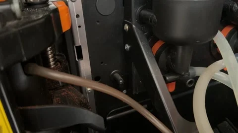 Brewing unit and tubing inside coffee vending machine close up, automatic Stock Footage 337121548