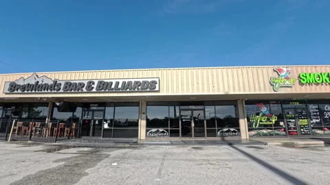 Brewlands Bar and Billiards and Higher Up Smoke Shop in Lakeland Florida Stock Footage 344353953