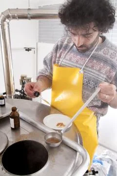 Brewmaster monitors the process Stock Photos