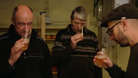 Brewmasters Tasting and Assessing Artisanal Craft Beer inside Brewery Cellar 스톡 동영상 346767495