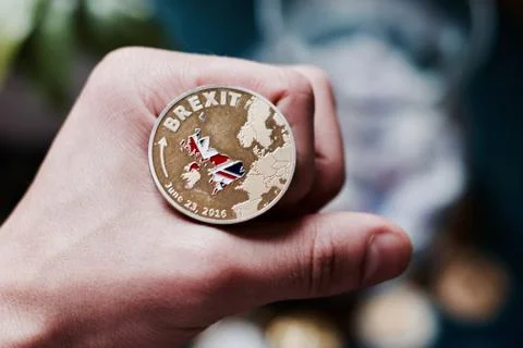 Brexit coin in hand Stock Photos