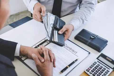 Bribery and corruption concept, bribe in the form of dollar bills, Businessma Stock Photos