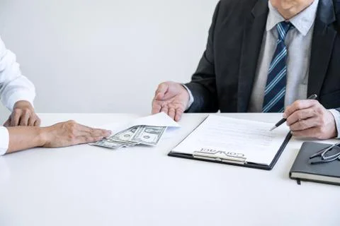 Bribery and corruption concept, bribe in the form of dollar bills, Businesswo Stock Photos