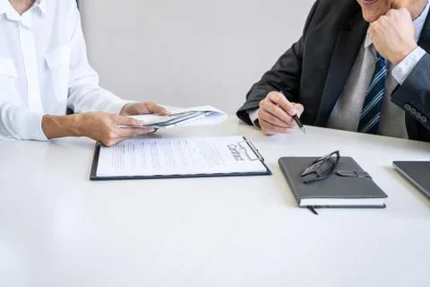 Bribery and corruption concept, bribe in the form of dollar bills, Businesswo Stock Photos