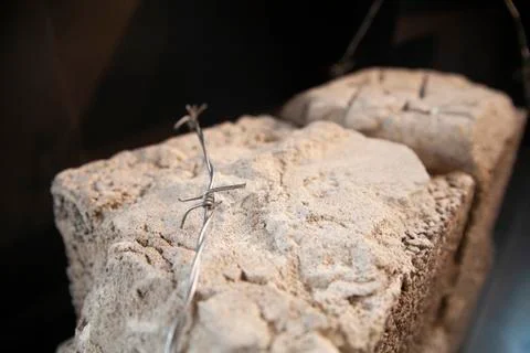 Brick and barbed wire Stock Photos