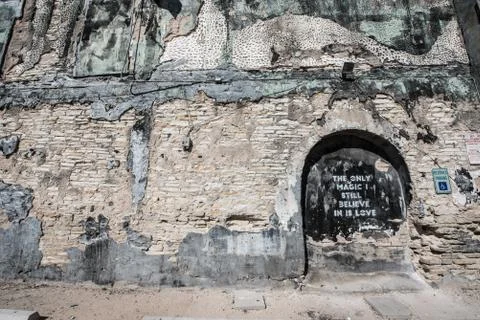 Brick and Cement Wall Background with Tasteful Graffiti Stock Photos