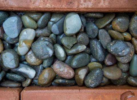 Brick and pebble background Stock Photos
