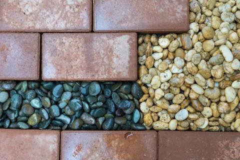 Brick and pebble background Stock Photos