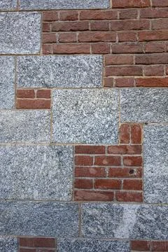 Brick And Stone Wall Pattern With Red Brick And Gray Granite Blocks For Ext.. Stock Photos