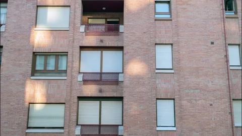 Brick Apartment Building Facade With Windows And Balconies In Urban Architecture Stock Footage 322096468