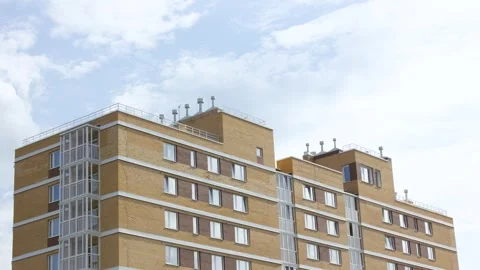 Brick apartment building. Red brick house windows. City apartment animation. Stock Footage 340794765