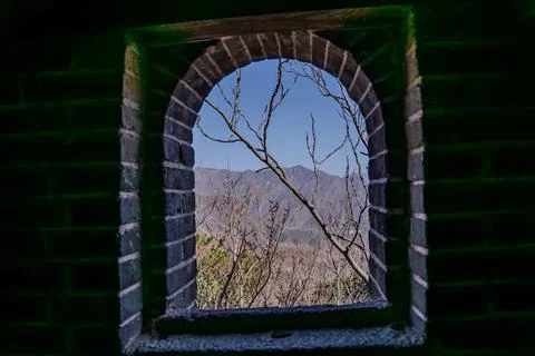 Brick arch opening with mountains beyond Great Wall Stock Photos