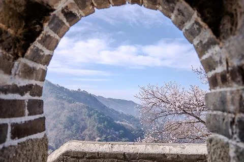 Brick arch window framing mountain view on Great Wall Stock Photos