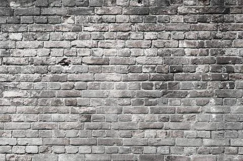 Brick background. Surface of old grey brick wall. Stock Photos