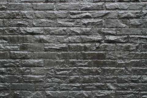 Brick black wall background Stock Photos