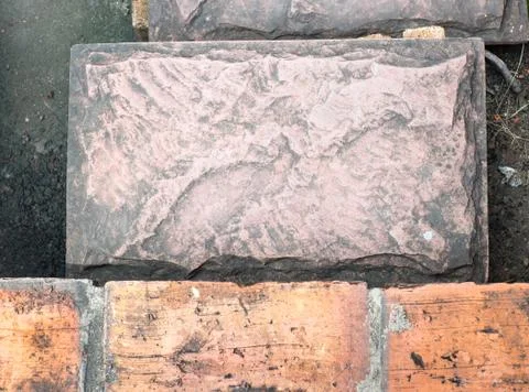 Brick block on pavement Stock Photos