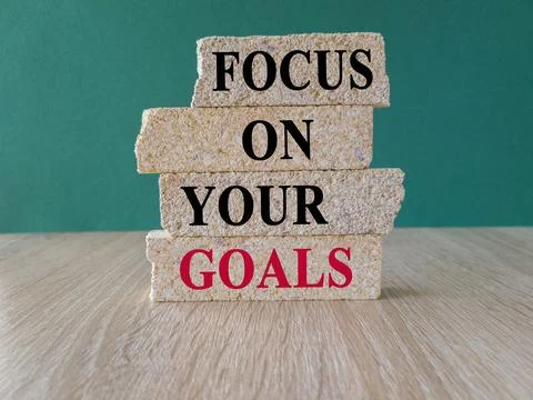 Brick blocks with the expression Focus on your goals . Stock Photos