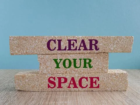 Brick blocks with red words Clear your space. Stock Photos