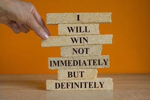 Brick blocks with text I will win not immediately but definitely Stock Photos