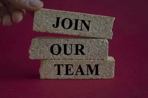 Brick blocks with words Join our team. Beautiful red background. Stock Photos