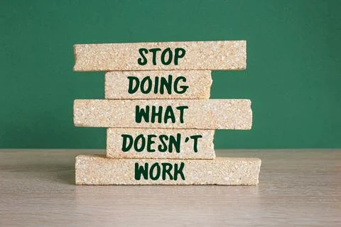 Brick blocks with words Stop Doing What Doesn't Work Foto stock