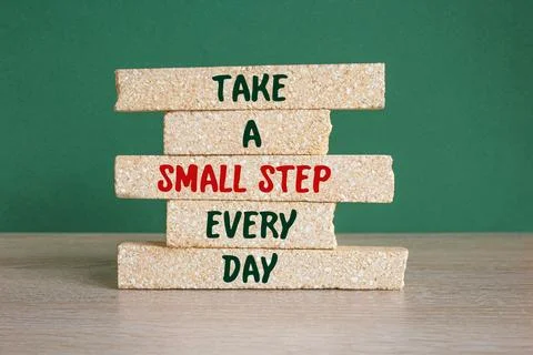 Brick blocks with words Take a small step every day. Stock Photos