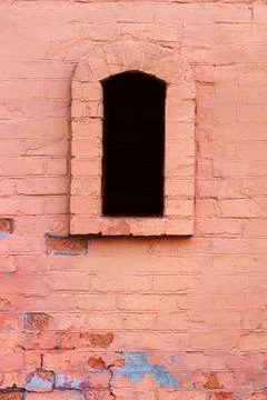 Brick building with arched window. Stock Photos