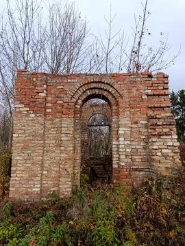 A brick building with a broken window in the middle of it Stock Photos