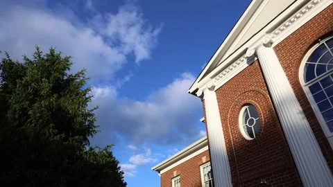 Brick building with columns under blue sky Stock Footage 337795927
