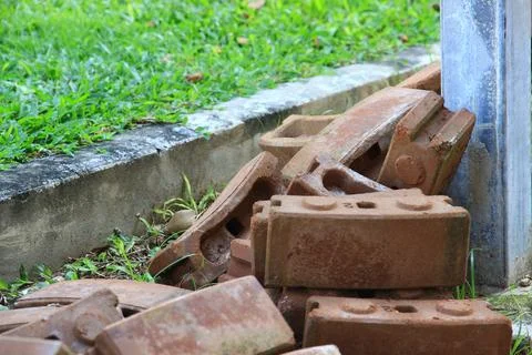 Brick building construction on the lawn. Stock Photos