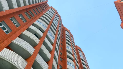 Brick building exterior low angle blue sky moving shot Stock Footage 150198193