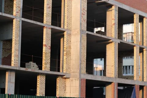 Brick building under construction, construction of a shopping center Stock Photos