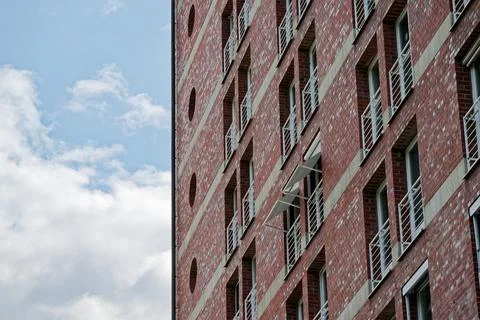 Brick building under construction with tiny door balconies 스톡 사진