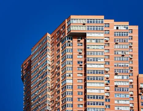 Brick building with windows on sky background Stock-Fotos